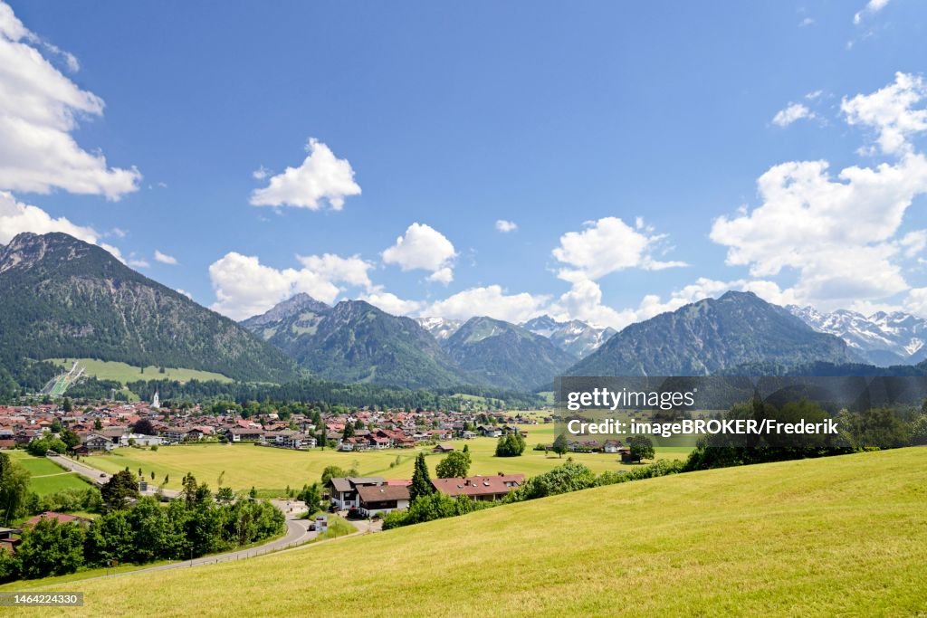 View from a vantage point over Oberstdorf and the Allgaeu Alps, blue cloudy sky, Allgaeu, Bavaria, Germany