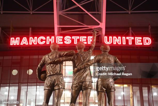 General view of the Trinity Statue on the outside of the stadium of Sir Bobby Charlton, George Best and Denis Law prior to the Premier League match...