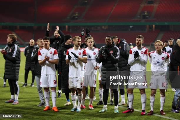 Players of 1. FC Nürnberg celebrate after winning the DFB Cup round of 16 match between 1. FC Nürnberg and Fortuna Düsseldorf at Max-Morlock-Stadion...