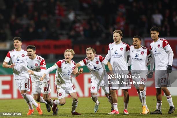 Players of 1. FC Nürnberg react after winning the penalty shoot out after the DFB Cup round of 16 match between 1. FC Nürnberg and Fortuna Düsseldorf...