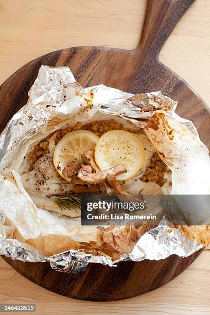 dover sole papillote with farro & chanterelles - sole photos et images de collection