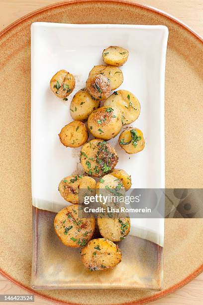 platter of sauteed german butterball potatoes - sauteed stock pictures, royalty-free photos & images
