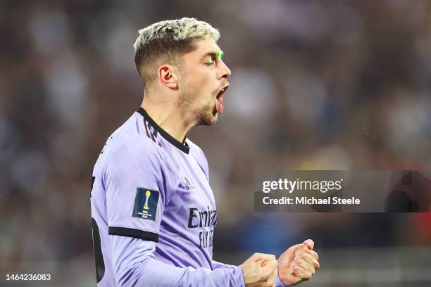 Laser beam is seen on the face of Federico Valverde of Real Madrid as he celebrates after scoring the team's second goal during the FIFA Club World...