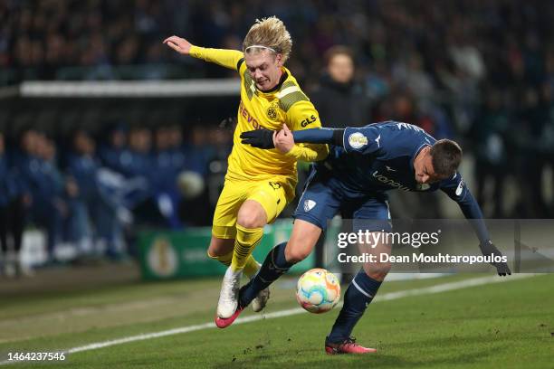 Julian Brandt of Borussia Dortmund battles for possession with Philipp Förster of VfL Bochum during the DFB Cup round of 16 match between VfL Bochum...