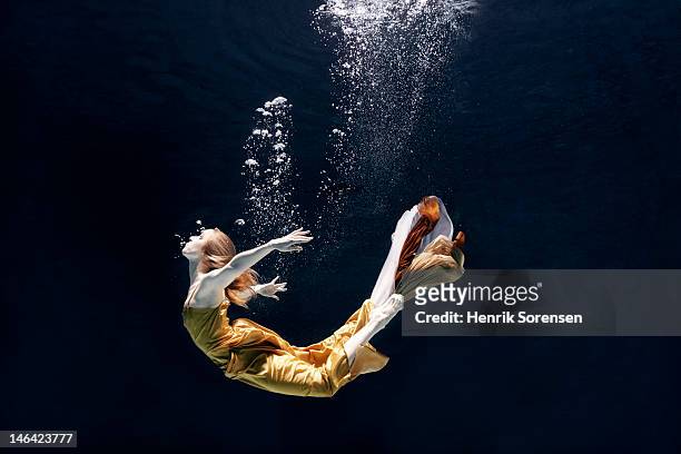 ballet dancer underwater - floating stock pictures, royalty-free photos & images