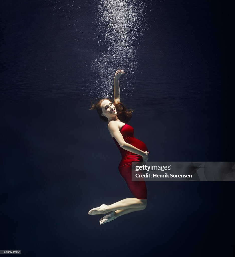 Pregnant woman underwater