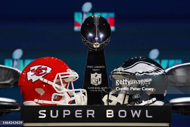 View of the Vince Lombardi Trophy and the helmets of the Kansas City Chiefs and the Philadelphia Eagles before a press conference for NFL...