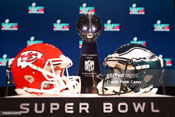 View of the Vince Lombardi Trophy and the helmets of the Kansas City Chiefs and the Philadelphia Eagles before a press conference for NFL...