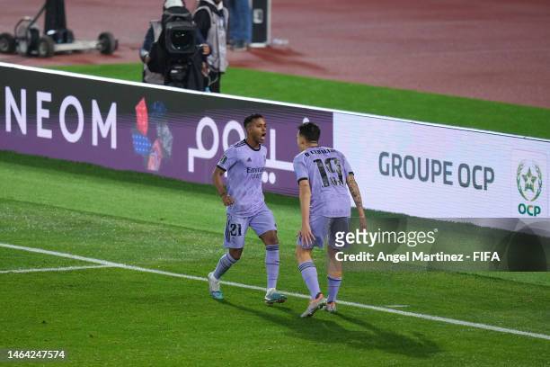 Rodrygo of Real Madrid celebrates with teammate Dani Ceballos after scoring the team's third goal during the FIFA Club World Cup Morocco 2022 Semi...