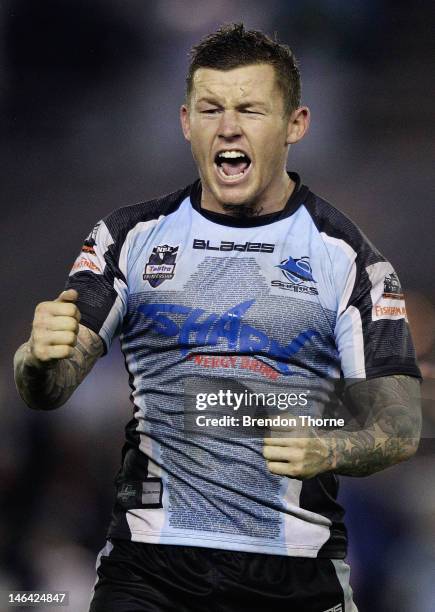 Todd Carney of the Sharks celebrates at full time after victory over the Warriors during the round 15 NRL match between the Cronulla Sharks and the...
