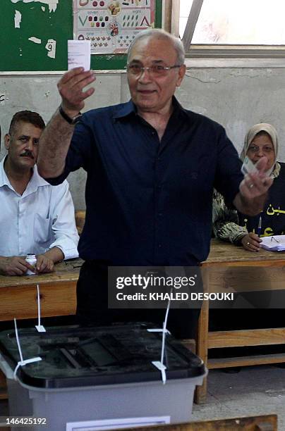 Egypt's army-backed presidential candidate Ahmed Shafiq casts his vote at a polling station in Cairo on June 16, 2012 in the divisive presidential...