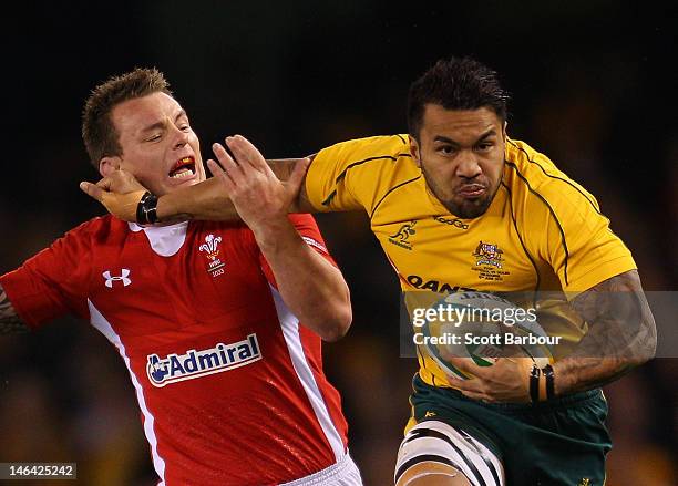 Digby Ioane of the Wallabies is tackled during the International Test Match between the Australian Wallabies and Wales at Etihad Stadium on June 16,...