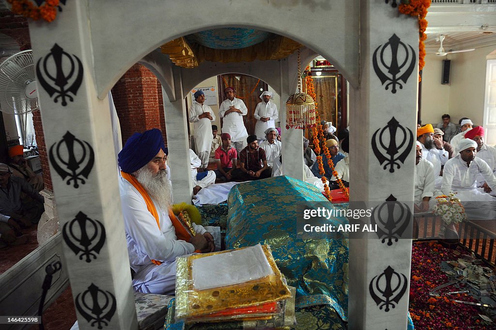 Sikh Rituals Sikh pilgrims attend religious rituals at the Gurdwara in Lahore on ...