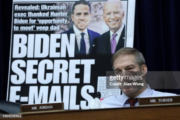With a poster of a New York Post front page story about Hunter Biden’s emails on display, U.S. Rep. Jim Jordan listens during a hearing before the...