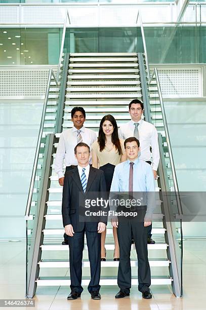group portrait of business people - portrait of young woman standing against steps stock pictures, royalty-free photos & images