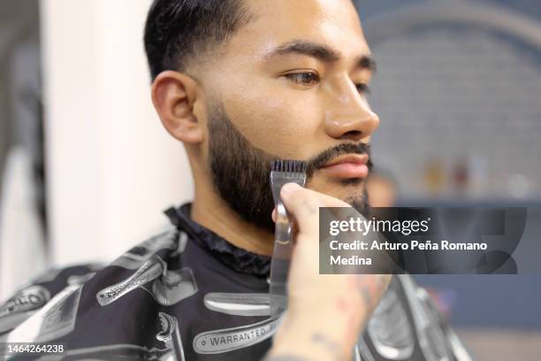 barber applying beard dye - black dye stock pictures, royalty-free photos & images