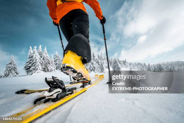 close up on a boot and a ski during ski touring adventure - skidpjäxor bildbanksfoton och bilder