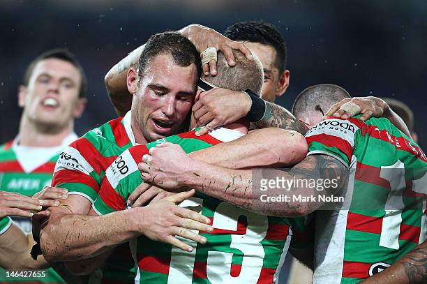 South Sydney players congratulate Michael Crocker after he scored during the round 15 NRL match between the Parramatta Eels and the South Sydney...
