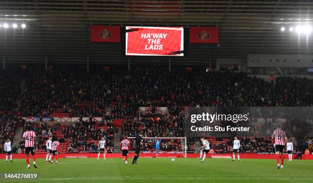 The big screen shows a 'Ha'way the lads' sign as the game kicks off during the Emirates FA Cup Fourth Round Replay between Sunderland and Fulham at...