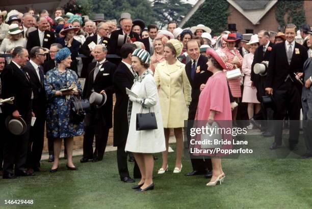 Queen Elizabeth II with Princess Anne and the Queen Mother in the unsaddling enclosure at Ascot, 17th June 1970. They are awaiting the arrival of the...