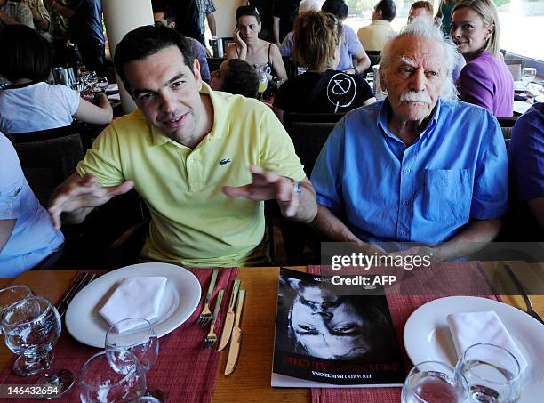 Syriza leftist radical party leader, Alexis Tsipras and Greek resistance hero, politician and writer Manolis Glezos sit in a restaurant in Athens...