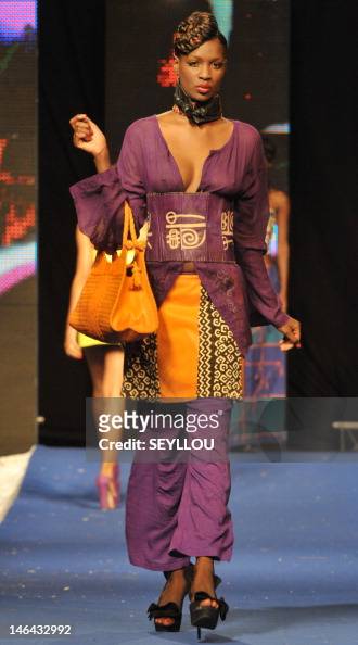 A model presents a creation by Malian designer Awa Maite during the ...
