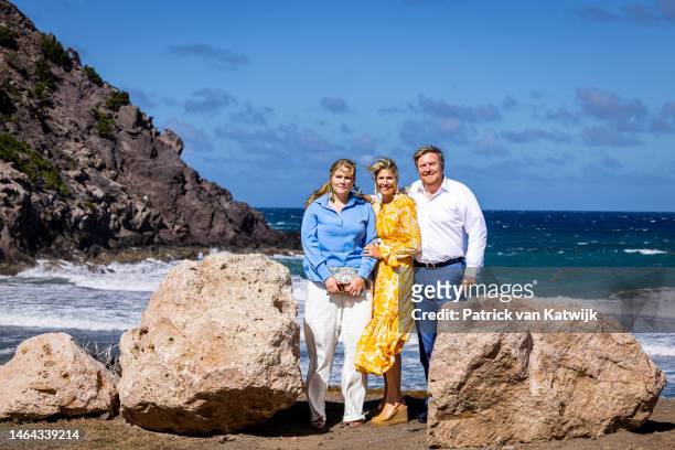 Princess Amalia of The Netherlands, Queen Maxima of The Netherlands and King Willem-Alexander of The Netherlands at the coast of the island during...