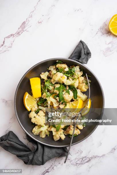 cauliflower and tuna salad - rocket book stock pictures, royalty-free photos & images