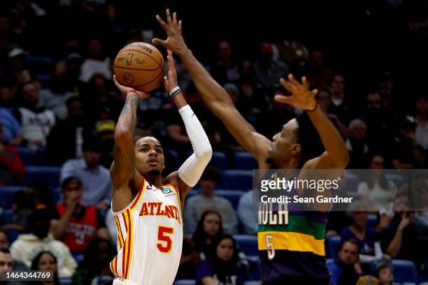 Dejounte Murray of the Atlanta Hawks shoots over Herbert Jones of the New Orleans Pelicans during the fourth quarter of an NBA game at Smoothie King...
