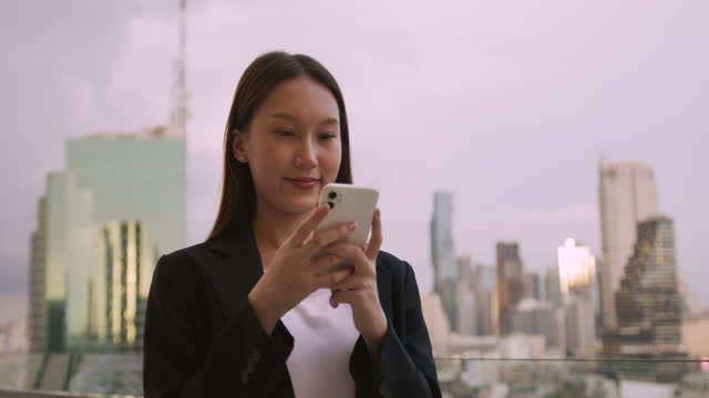 Asian Businesswoman using Smart phone