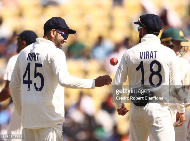 Rohit Sharma of India speaks with Virat Kohli during day one of the First Test match in the series between India and Australia at Vidarbha Cricket...