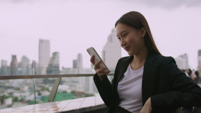 Asian Businesswoman using Smart phone