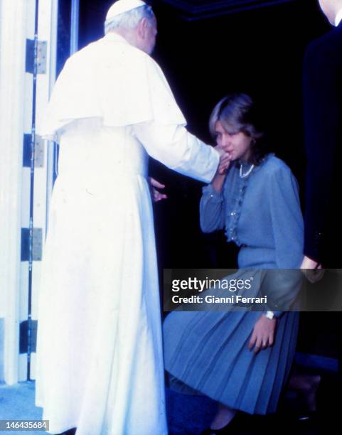 During his official visit to Spain, the Pope John Paul II is greeted by the Infanta Cristina, daughter of the Spanish Kings at the Royal Palace,...