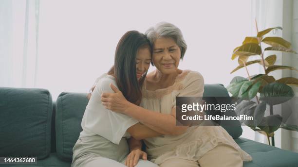 mother and daughter support each other. - family decisions stock pictures, royalty-free photos & images