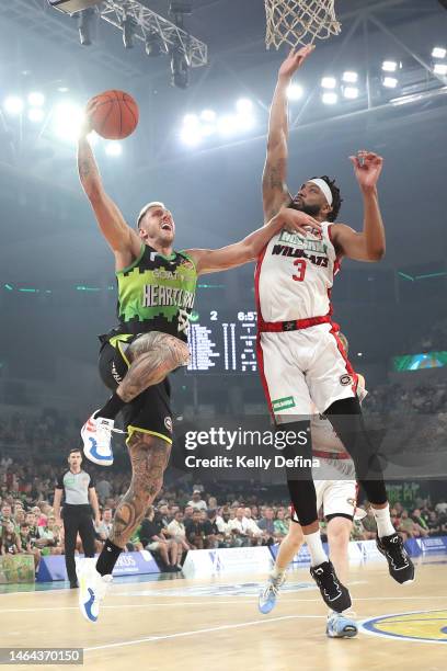 Mitchell Creek of the Phoenix drives to the basket against TaShawn Thomas of the Wildcats during the NBL Play In match between South East Melbourne...