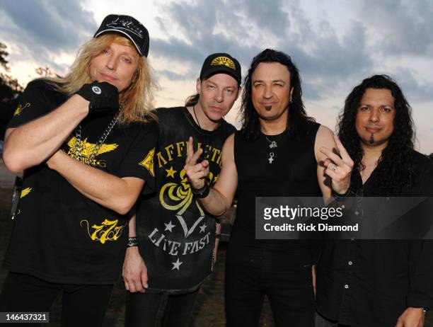 Robert Sweet, Tim Gaines, Robert Sweet and Oz Fox of Stryper backstage at the 2012 BamaJam Music and Arts Festival - Day 2 on BamaJam Farms in...