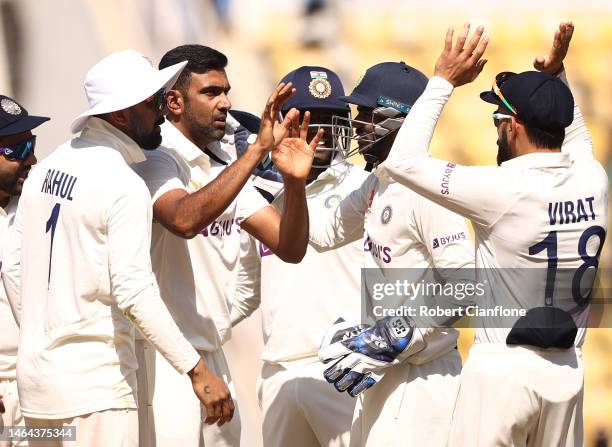 Ravichandran Ashwin of India celebrates taking the wicket of Alex Carey of Australia during day one of the First Test match in the series between...