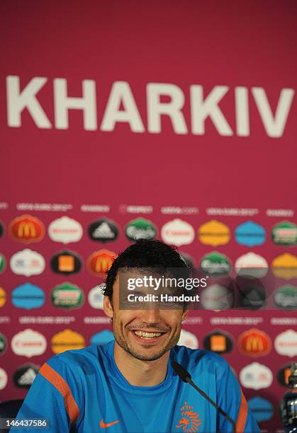 In this handout image provided by UEFA, Mark van Brommel of Netherlands talks to the media during a UEFA EURO 2012 press conference at the Metalist...