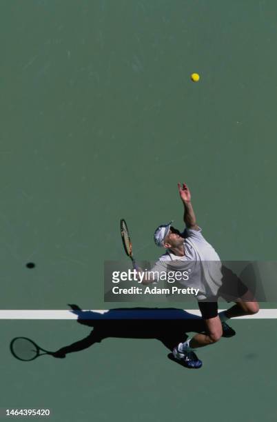 Andre Agassi from the United States serves to Arnaud Clément of France during their Men's Singles Final match at the Australian Open Tennis...
