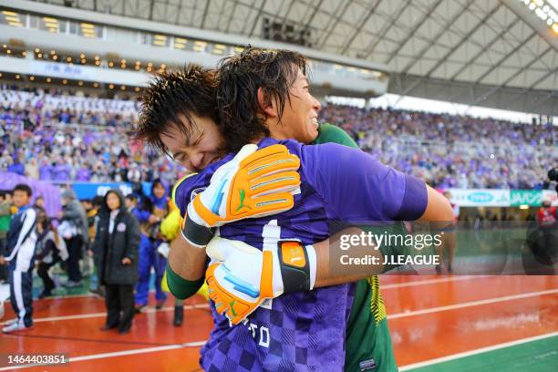 Shusaku Nishikawa and Hisato Sato of Sanfrecce Hiroshima celebrate the J.League J1 season champions following the team's 4-1 victory in the J.League...