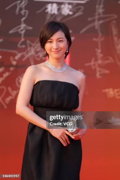 Japanese actress Ryoko Hirosue arrives at the red carpet during the opening ceremony for the 15th Shanghai International Film Festival at Shanghai...