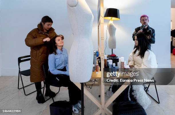 Stylist works on a dancer's hairstyle backstage prior to the parade of 20 dancers from the Real Conservatorio Profesional de Danza Mariemma, through...