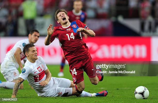 Eugen Polanski of Poland brings down Vaclav Pilar of Czech Republic during the UEFA EURO 2012 group A match between Czech Republic and Poland at The...