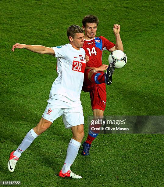 Lukasz Piszczek of Poland and Vaclav Pilar of Czech Republic compete for the ball during the UEFA EURO 2012 group A match between Czech Republic and...