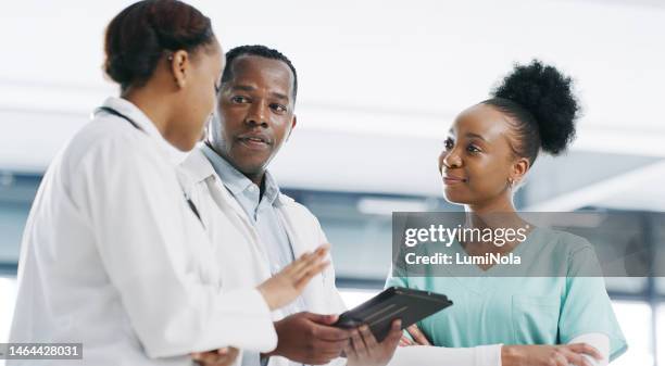 medical teamwork, tablet and doctors in hospital for management, collaboration or consulting ideas. healthcare group, digital technology and planning research, medicine advice or discussion in clinic - operations manager stock pictures, royalty-free photos & images