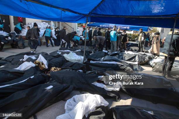 Body bags lie on the floor in a cemetery morgue on February 09, 2023 in Hatay, Turkey. A 7.8-magnitude earthquake hit near Gaziantep, Turkey, in the...