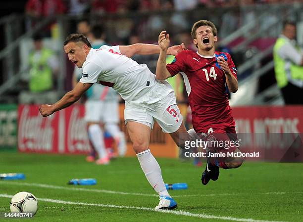 Dariusz Dudka of Poland and Vaclav Pilar of Czech Republic compete for the ball during the UEFA EURO 2012 group A match between Czech Republic and...