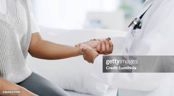 doctor, patient and hands on wrist with pulse for blood pressure, wellness or consulting in hospital. female medical professional, black woman or helping hand for healthcare, advice or test in clinic - wrist stock pictures, royalty-free photos & images