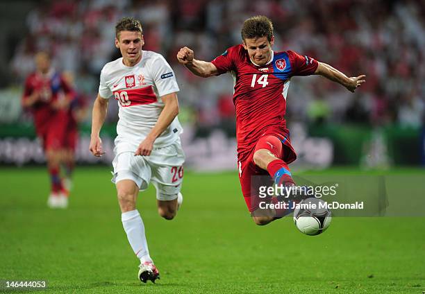 Lukasz Piszczek of Poland chases down Vaclav Pilar of Czech Republic during the UEFA EURO 2012 group A match between Czech Republic and Poland at The...