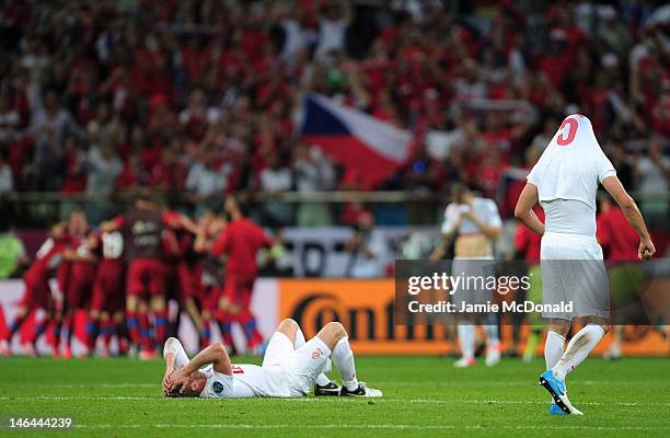 Damien Perquis of Poland lies on the pitch at the final whistle during the UEFA EURO 2012 group A match between Czech Republic and Poland at The...